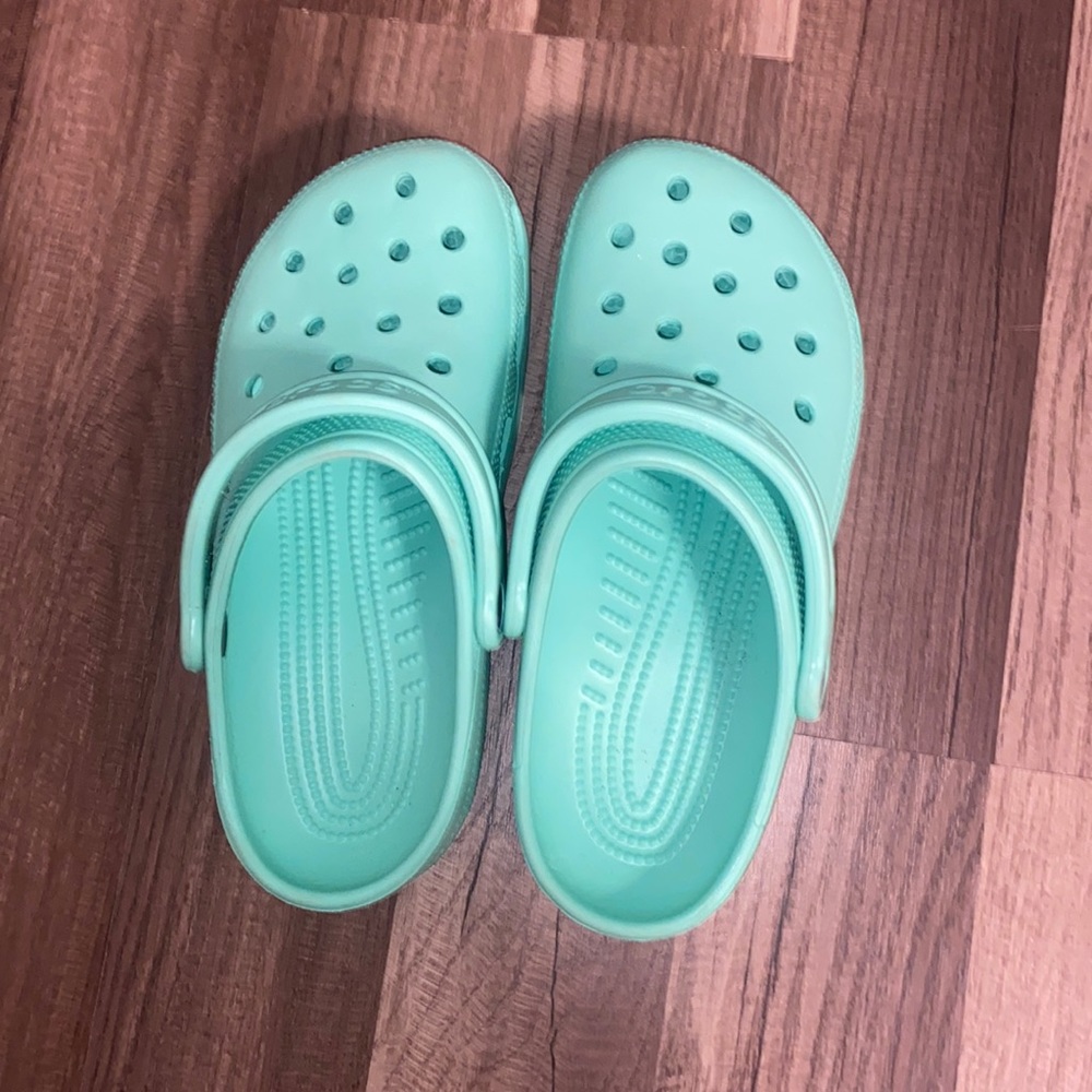 Mint green crocs for sale.